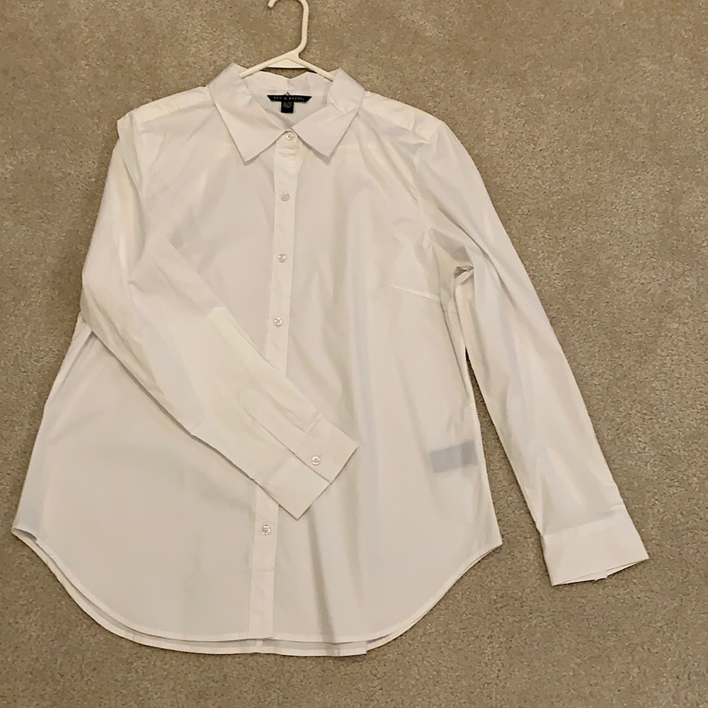 Women’s long sleeved white blouse.